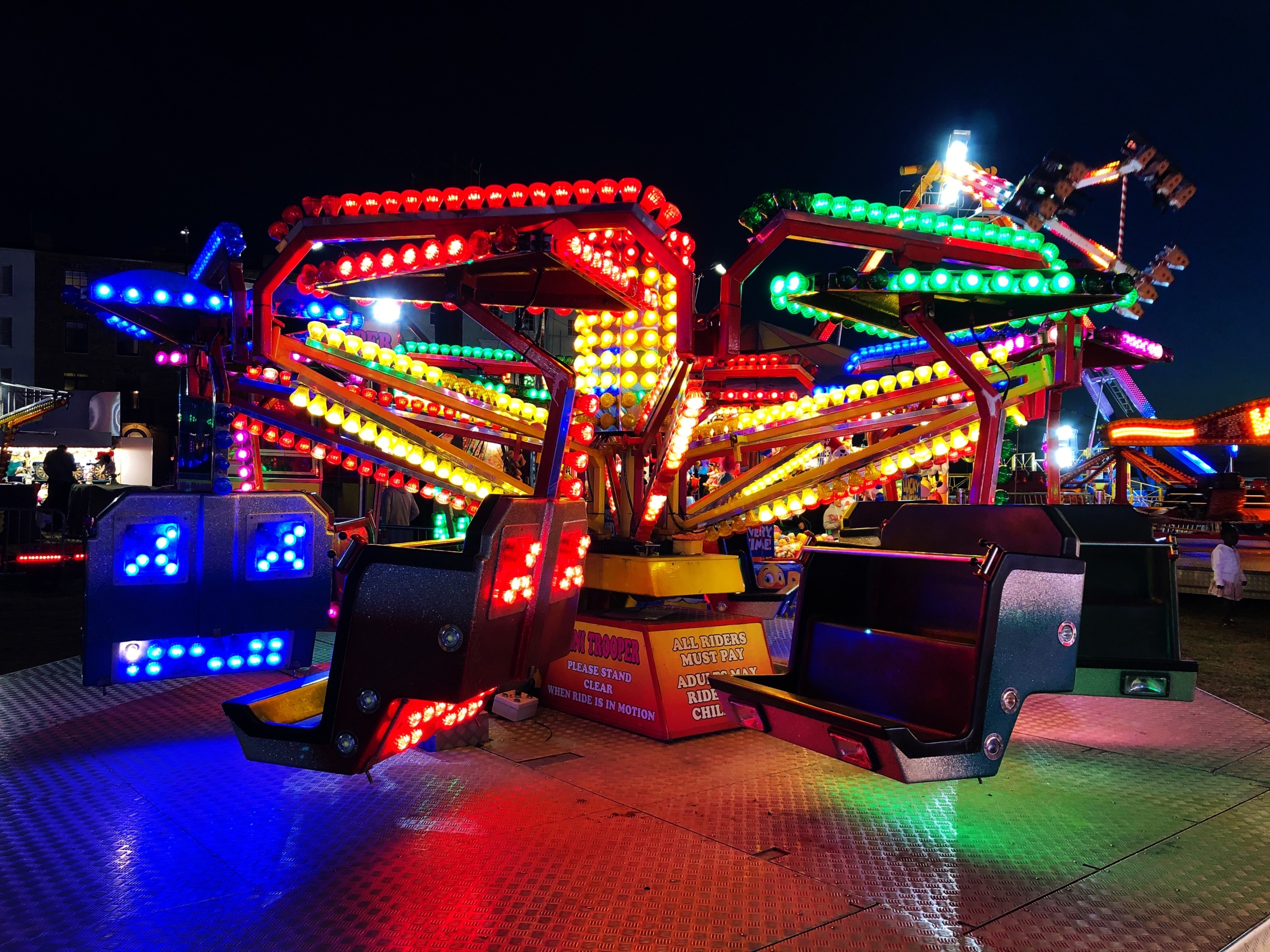 fairground at night with neon lights